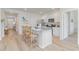 Open kitchen featuring white cabinets, granite countertops, and an island with bar stool seating at 489 Blissful Ln., Little River, SC 29566