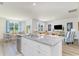 Bright, open kitchen with an island overlooking the dining and living areas at 489 Blissful Ln., Little River, SC 29566