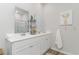 Modern bathroom featuring double sinks, white cabinetry, and sleek fixtures at 493 Blissful Ln., Little River, SC 29566