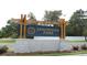 Elegant community sign for Sandridge Park, featuring stone accents and lush landscaping at 493 Blissful Ln., Little River, SC 29566