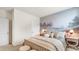 Cozy bedroom featuring a scenic mural, comfortable bed, and soft lighting at 497 Blissful Ln., Little River, SC 29566