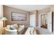 Serene living room with neutral tones, a comfortable sofa, and a large painting, creating a cozy and inviting space at 497 Blissful Ln., Little River, SC 29566