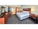 Bright, open bedroom featuring a queen-sized bed and kitchenette at 5200 N Ocean Blvd. # 640, Myrtle Beach, SC 29577