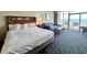 Bright, open bedroom with an ocean view from the attached balcony at 5200 N Ocean Blvd. # 640, Myrtle Beach, SC 29577