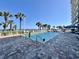 Outdoor pool area with ocean view, featuring lounge chairs, palm trees, and splash pad at 5200 N Ocean Blvd. # 640, Myrtle Beach, SC 29577