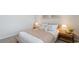 Cozy bedroom featuring neutral tones, carpet, and comfortable queen bed with stylish pillows and a throw at 523 Blissful Ln., Little River, SC 29566