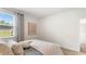 Neutral bedroom with a window view, plush bedding, and a cozy atmosphere, perfect for relaxation at 523 Blissful Ln., Little River, SC 29566