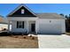 Charming single-Gathering home with a two-car garage and a welcoming front porch at 523 Blissful Ln., Little River, SC 29566