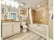 Clean bathroom with vanity, ample lighting, and shower-tub combination at 5300 N Ocean Blvd. # 1102, Myrtle Beach, SC 29577