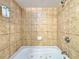 Relaxing bathtub with tiled walls and jacuzzi jets at 5300 N Ocean Blvd. # 1102, Myrtle Beach, SC 29577