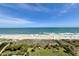 Beautiful beach view from condo including dunes, grass, beach and ocean at 5300 N Ocean Blvd. # 1102, Myrtle Beach, SC 29577