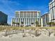 Multi-story condo building featuring multiple balconies offering stunning views at 5300 N Ocean Blvd. # 1102, Myrtle Beach, SC 29577