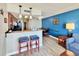 Modern kitchen with stainless steel appliances and breakfast bar in an open layout at 5300 N Ocean Blvd. # 1102, Myrtle Beach, SC 29577