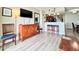 Bright living area featuring coastal decor, a large TV, and balcony access at 5300 N Ocean Blvd. # 1102, Myrtle Beach, SC 29577