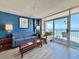 Inviting living room with balcony access offering stunning ocean views at 5300 N Ocean Blvd. # 1102, Myrtle Beach, SC 29577