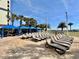 Inviting pool deck with rows of lounge chairs and beach view, ideal for relaxation at 5300 N Ocean Blvd. # 1102, Myrtle Beach, SC 29577