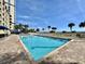 Community pool surrounded by lounge chairs and umbrellas, with beach views at 5300 N Ocean Blvd. # 1102, Myrtle Beach, SC 29577
