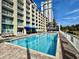 Community pool surrounded by lounge chairs and umbrellas, with beach views at 5300 N Ocean Blvd. # 1102, Myrtle Beach, SC 29577