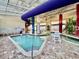 Indoor pool area offering a fun water slide, shallow pool, lazy river and seating for relaxation at 5300 N Ocean Blvd. # 1102, Myrtle Beach, SC 29577