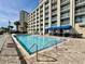 Large, sparkling swimming pool with ladder access, perfect for a refreshing swim on a sunny day at 5300 N Ocean Blvd. # 1102, Myrtle Beach, SC 29577