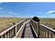 Wooden walkway overlooking the ocean featuring beach access at 5300 N Ocean Blvd. # 1102, Myrtle Beach, SC 29577