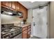 Functional kitchenette with an electric stovetop, microwave, and storage cabinets at 5300 N Ocean Blvd. # 410, Myrtle Beach, SC 29577