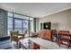 Comfortable living room with a television, seating, and balcony with an ocean view at 5300 N Ocean Blvd. # 410, Myrtle Beach, SC 29577