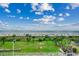 Beautiful ocean view from the building with palm trees and sandy beach below at 5300 N Ocean Blvd. # 410, Myrtle Beach, SC 29577