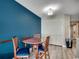 Comfortable dining area adjacent to the living room, featuring a round table and three chairs at 5300 Ocean Blvd. N # 903, Myrtle Beach, SC 29577