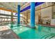 Inviting indoor pool area featuring beach access and comfortable lounge chairs, perfect for year-round enjoyment at 5300 Ocean Blvd. N # 903, Myrtle Beach, SC 29577