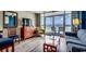 Cozy living room featuring ocean views, comfortable seating, a TV, and access to the balcony at 5300 Ocean Blvd. N # 903, Myrtle Beach, SC 29577