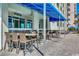 Outdoor patio with tables and chairs, perfect for dining and enjoying the coastal views at 5300 Ocean Blvd. N # 903, Myrtle Beach, SC 29577