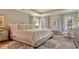 Bright main bedroom with tray ceiling, decorative curtains, and comfortable furnishings at 541 Magnolia Terrace Dr, Myrtle Beach, SC 29579