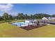 Community outdoor pool with lounge chairs, tables, and grilling area at 541 Magnolia Terrace Dr, Myrtle Beach, SC 29579