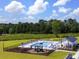 Community outdoor pool with lounge chairs and playground at 541 Magnolia Terrace Dr, Myrtle Beach, SC 29579