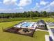 Community outdoor pool with lounge chairs and playground at 541 Magnolia Terrace Dr, Myrtle Beach, SC 29579