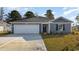Charming single-story home with a gray exterior, attached garage, and well-manicured lawn at 548 Scarlet Sage Dr., Conway, SC 29527
