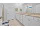 Bright bathroom featuring double sinks with granite countertops and white cabinetry at 5545 Whitebark Dr., Myrtle Beach, SC 29577