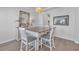 Bright dining room with wood floors, white chairs, and a rustic-style dining table at 5545 Whitebark Dr., Myrtle Beach, SC 29577