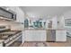 Gourmet kitchen with stainless steel appliances and a view to the open-concept living area at 5545 Whitebark Dr., Myrtle Beach, SC 29577