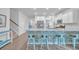 Spacious kitchen with white cabinets, granite countertops, and a stylish blue island at 5545 Whitebark Dr., Myrtle Beach, SC 29577