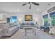Bright living room featuring plush seating, stylish decor, and a ceiling fan at 5545 Whitebark Dr., Myrtle Beach, SC 29577