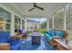 Screened porch with outdoor seating and ceiling fan at 5545 Whitebark Dr., Myrtle Beach, SC 29577