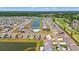 Aerial view showcases community with multiple ponds, golf course and single-Gathering homes at 57 Eagle Claw Dr., Carolina Shores, NC 28467