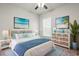 Virtual staging shows a relaxing bedroom with beach art and coastal décor at 57 Eagle Claw Dr., Carolina Shores, NC 28467