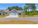 Charming single-Gathering home with a two-car garage, gray siding, and a well-manicured front lawn at 57 Eagle Claw Dr., Carolina Shores, NC 28467