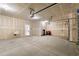 Spacious two-car garage featuring sealed concrete floor, drywall and overhead lighting at 57 Eagle Claw Dr., Carolina Shores, NC 28467