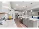 Open concept kitchen with eat in island, stainless steel appliances, and wood look floors at 57 Eagle Claw Dr., Carolina Shores, NC 28467