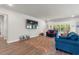 Spacious living room showcasing wood floors, modern decor, and lots of natural light at 57 Eagle Claw Dr., Carolina Shores, NC 28467