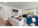 Bright living room with hardwood floors, stylish furniture, and large windows offering plenty of natural light at 57 Eagle Claw Dr., Carolina Shores, NC 28467
